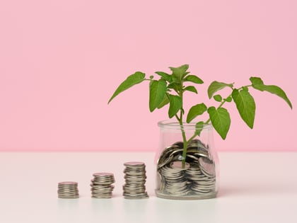 white-coins-in-a-glass-jar-and-on-the-table-sprou-2022-05-19-13-27-18-utc-1